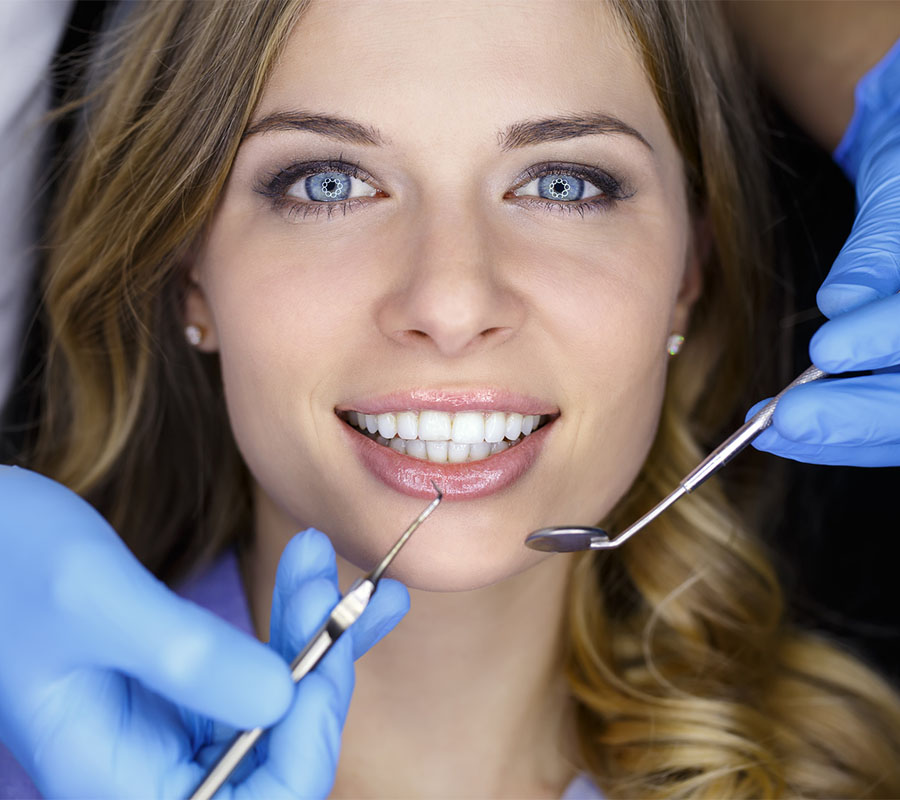 Dentist examining a patient's teeth in the dentist.
